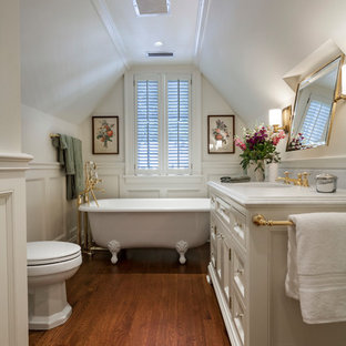 Elegant 3/4 medium tone wood floor and brown floor bathroom photo in Other with recessed-panel cabinets, white cabinets, white walls and an undermount sink