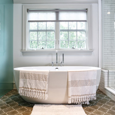 Example of a transitional white tile and subway tile bathroom design in New York