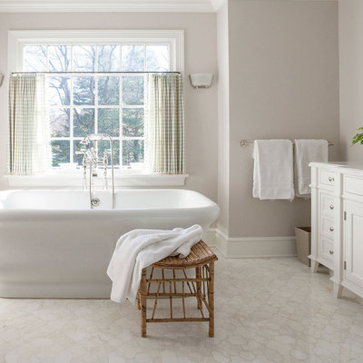 Example of a large classic master white tile and stone slab terra-cotta tile and white floor bathroom design in New York with an undermount sink, recessed-panel cabinets, white cabinets, gray walls, a one-piece toilet, solid surface countertops and white countertops