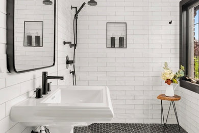 Bathroom - small transitional 3/4 white tile and subway tile ceramic tile and black floor bathroom idea in Seattle with a pedestal sink and white walls