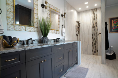 Example of a large transitional master gray tile and porcelain tile porcelain tile and gray floor bathroom design in Other with flat-panel cabinets, black cabinets, gray walls, an undermount sink, quartz countertops and gray countertops
