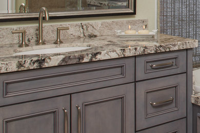 Bathroom - large traditional master bathroom idea in Phoenix with recessed-panel cabinets, gray cabinets, beige walls, an undermount sink and granite countertops