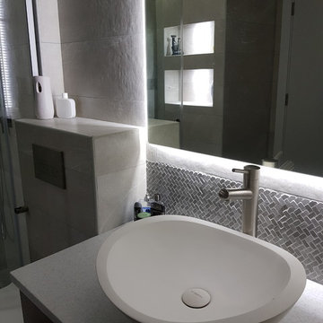 Grey grey modern bathroom with a walk in shower