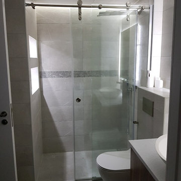 Grey grey modern bathroom with a walk in shower