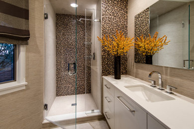 Mid-sized trendy 3/4 beige tile and porcelain tile porcelain tile alcove shower photo in New York with flat-panel cabinets, white cabinets, a one-piece toilet, beige walls, an undermount sink and quartz countertops