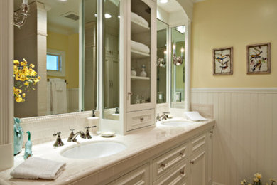 Photo of an expansive traditional bathroom in Orange County with a submerged sink, freestanding cabinets, white cabinets, white tiles, ceramic tiles and yellow walls.