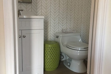 Transitional 3/4 white tile and ceramic tile brown floor bathroom photo in Chicago with shaker cabinets, white cabinets, solid surface countertops and white walls