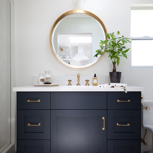 Inspiration for a mid-sized coastal multicolored tile bathroom remodel in Los Angeles with black cabinets, marble countertops, white walls, a console sink and shaker cabinets