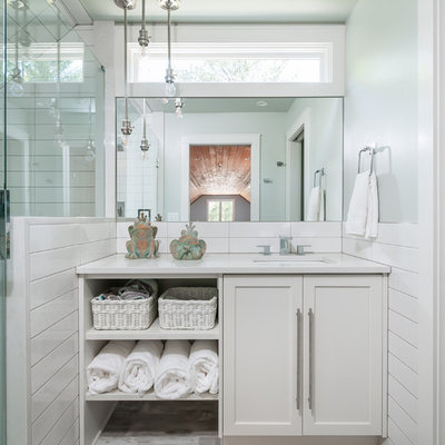 Small beach style white tile beige floor bathroom photo in Atlanta with shaker cabinets, white cabinets, green walls, an undermount sink and white countertops