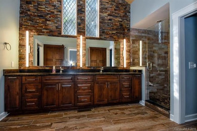Inspiration for a rustic bathroom remodel in Charlotte