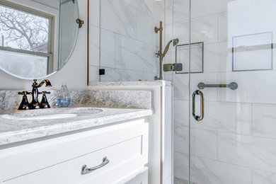 Inspiration for a contemporary master white tile and marble tile marble floor and white floor corner shower remodel in Nashville with white cabinets, white walls, an undermount sink and a hinged shower door