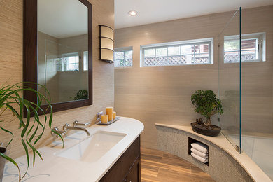 Tub/shower combo - transitional porcelain tile and beige tile porcelain tile tub/shower combo idea in San Francisco with an undermount sink, recessed-panel cabinets, dark wood cabinets, quartz countertops, an undermount tub and beige walls