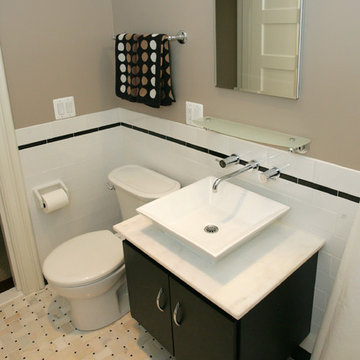 hall bathroom with custom sink and storage