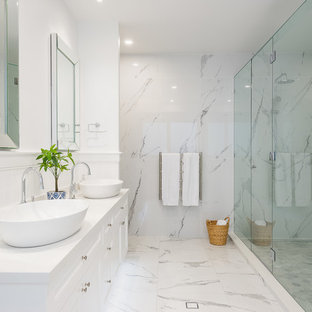 Large beach style master bathroom in Gold Coast - Tweed with white cabinets, marble, white walls, marble floors, a vessel sink, white floor, a hinged shower door, white benchtops, an alcove shower and white tile.