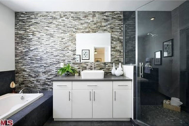 Mid-sized trendy gray tile bathroom photo in Los Angeles with a vessel sink, flat-panel cabinets, white cabinets and quartzite countertops