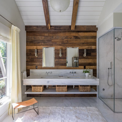 Beach style white tile gray floor corner shower photo in Boston with beige walls, an undermount sink and white countertops