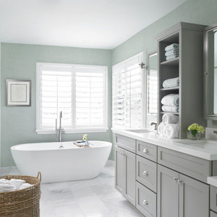 Beach style freestanding bathtub photo in Miami with an undermount sink, shaker cabinets and gray cabinets