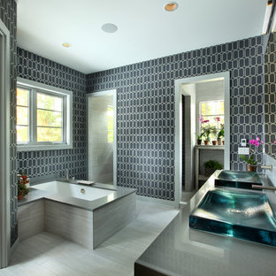 Example of a large trendy master gray tile and ceramic tile walk-in shower design in Grand Rapids with a vessel sink, an undermount tub and multicolored walls