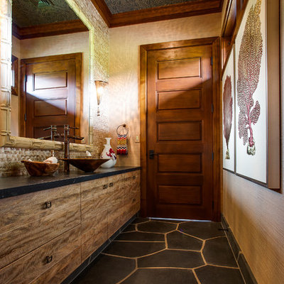 Inspiration for a tropical bathroom remodel in Vancouver with a vessel sink