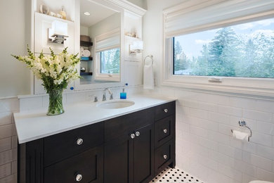 Alcove bathtub - small contemporary master white tile and ceramic tile mosaic tile floor alcove bathtub idea in Calgary with an undermount sink, shaker cabinets, dark wood cabinets, quartz countertops and gray walls