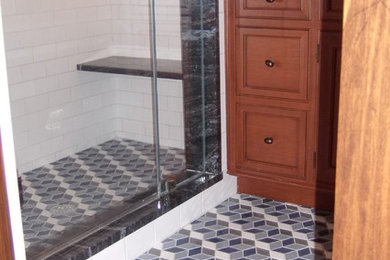 Mid-sized elegant 3/4 multicolored tile and ceramic tile ceramic tile alcove shower photo in New York with an undermount sink, beaded inset cabinets, medium tone wood cabinets, onyx countertops and white walls