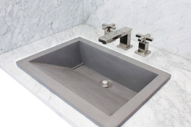 Inspiration for an industrial bathroom remodel with a drop-in sink