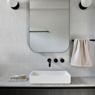 This is an example of a contemporary kids bathroom in Melbourne with grey cabinets, an open shower, a wall-mount toilet, gray tile, ceramic tile, white walls, a vessel sink, marble benchtops, grey floor, an open shower, grey benchtops, a single vanity and a floating vanity.