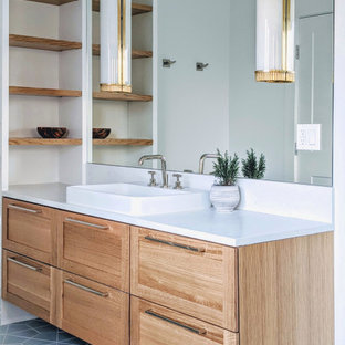 Inspiration for a mid-sized coastal master ceramic tile, blue floor and single-sink bathroom remodel in New York with light wood cabinets, white walls, white countertops, a floating vanity, shaker cabinets and a wall-mount sink