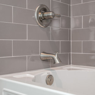 Bathroom - french country gray tile and subway tile double-sink bathroom idea in Louisville with recessed-panel cabinets, white cabinets, beige walls, a drop-in sink, granite countertops, beige countertops and a built-in vanity