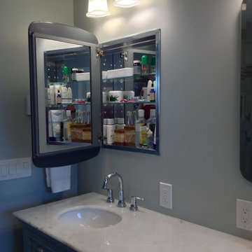Hidden storage in mirrored medicine cabinets