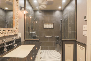 Example of a mid-sized transitional master porcelain tile and black floor bathroom design in Baltimore with furniture-like cabinets, white cabinets, a two-piece toilet, gray walls, an undermount sink and granite countertops