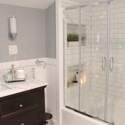 Mid-sized elegant master white tile and subway tile marble floor bathroom photo in Burlington with dark wood cabinets, a two-piece toilet, gray walls, an undermount sink and marble countertops