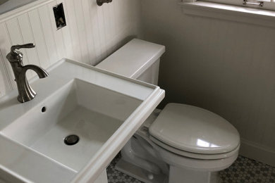 Example of an arts and crafts master ceramic tile bathroom design in Minneapolis with a pedestal sink