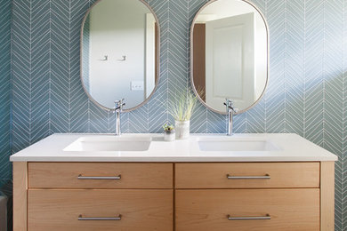 Bathroom - contemporary blue tile bathroom idea in Austin with flat-panel cabinets and medium tone wood cabinets