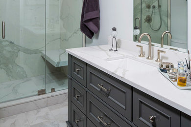 Mid-sized transitional master white tile and porcelain tile marble floor bathroom photo in Minneapolis with furniture-like cabinets, gray cabinets, blue walls, an undermount sink and quartz countertops