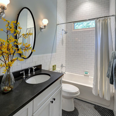 Tub/shower combo - mid-sized traditional white tile and ceramic tile mosaic tile floor tub/shower combo idea in Atlanta with an undermount sink, shaker cabinets, white cabinets, granite countertops, a one-piece toilet and blue walls