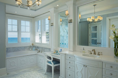 Bathroom - large coastal 3/4 blue tile, gray tile and marble tile marble floor and gray floor bathroom idea in Miami with raised-panel cabinets, white cabinets, blue walls, an undermount sink, quartz countertops, a hinged shower door and white countertops