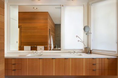 Example of a large trendy master bathroom design in San Francisco with an integrated sink, flat-panel cabinets, light wood cabinets, quartz countertops and white walls