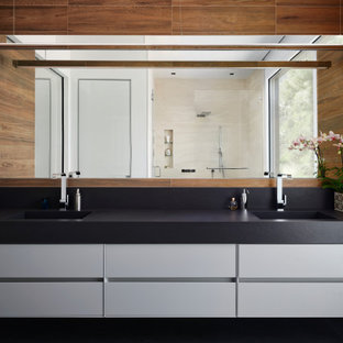 Bathroom - mid-sized contemporary master brown tile and wood-look tile ceramic tile, black floor and double-sink bathroom idea in San Francisco with flat-panel cabinets, an integrated sink, quartz countertops, black countertops, a floating vanity, white cabinets and brown walls