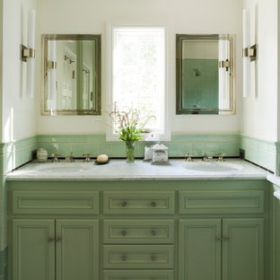 Photo of a classic bathroom in San Francisco with marble worktops and green cabinets.