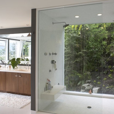Trendy white tile alcove shower photo in Vancouver with an undermount sink, flat-panel cabinets and medium tone wood cabinets