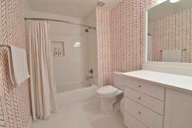 Bathroom - mid-sized traditional kids' white tile and subway tile porcelain tile and white floor bathroom idea in Denver with raised-panel cabinets, white cabinets, a two-piece toilet, pink walls, an undermount sink, quartz countertops and white countertops