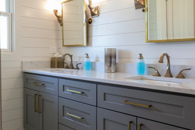 Example of a mid-sized transitional 3/4 white tile double-sink and shiplap wall bathroom design in Chicago with white cabinets, a one-piece toilet and quartz countertops