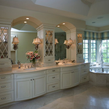 His and Her Vanities with arch-topped mirrors and glass-fronted towers
