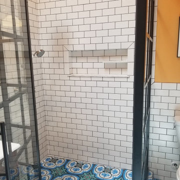 Historic bathroom using Walker Zanger tile and Gridscape shower glass by Coastal