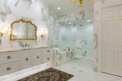 Inspiration for a large timeless master gray tile, white tile and marble tile marble floor and gray floor bathroom remodel in DC Metro with recessed-panel cabinets, white cabinets, gray walls, an undermount sink, marble countertops and a hinged shower door