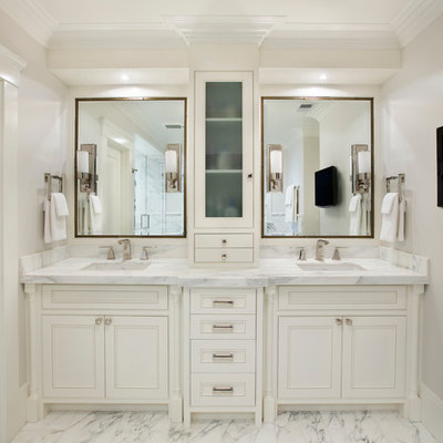 Inspiration for a mediterranean white tile bathroom remodel in San Francisco with an undermount sink, beaded inset cabinets, white cabinets and gray countertops