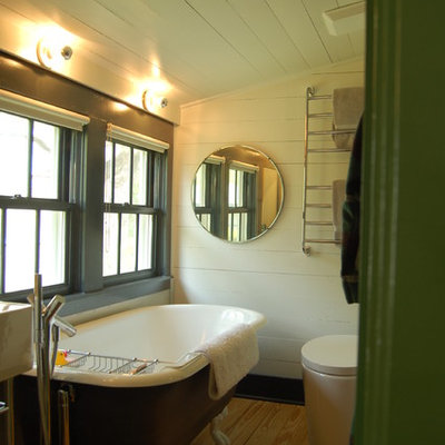 Inspiration for a country claw-foot bathtub remodel in Austin