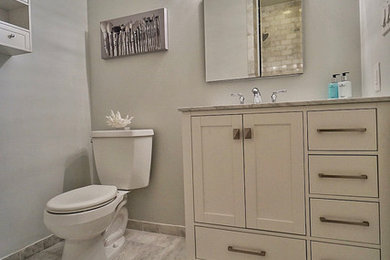 Example of a small transitional white tile bathroom design in New York