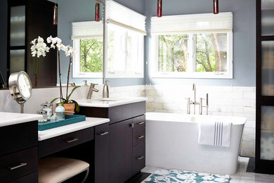 Bathroom - mid-sized transitional master gray tile and stone tile bathroom idea in Other with an undermount sink, dark wood cabinets, quartz countertops, a one-piece toilet, gray walls and flat-panel cabinets